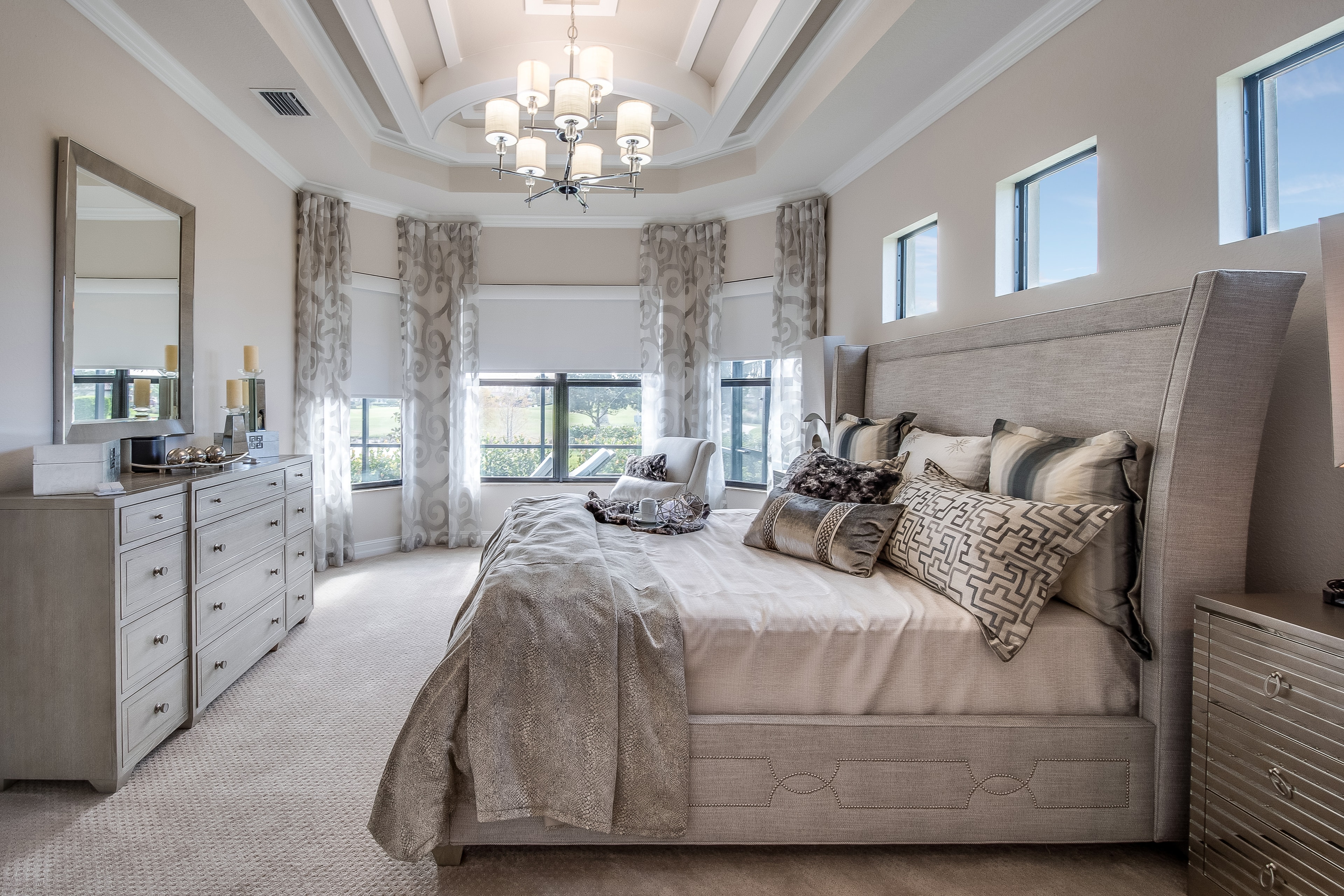 Luxury master bedroom suite with tray ceiling